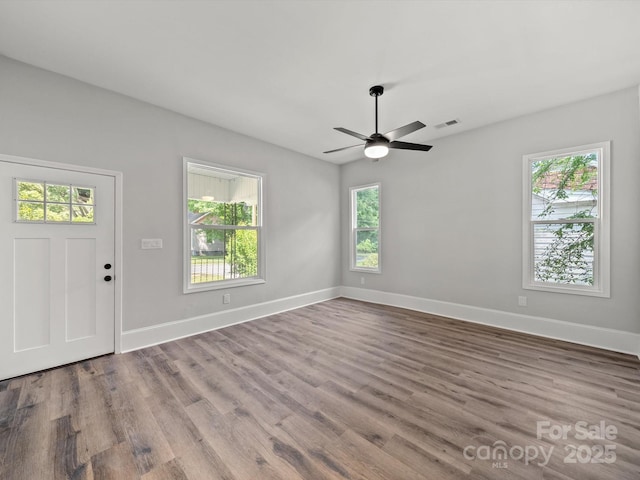 144 Walnut St, Chester, SC 29706 - entrance foyer with wood finished floors and ceiling fan