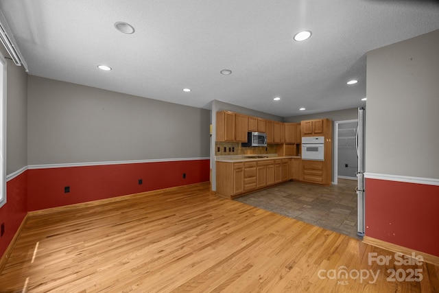 449 Concord Rd, Fletcher, NC 28732 - kitchen with appliances with stainless steel finishes, light wood finished floors, light countertops, recessed lighting, and baseboards