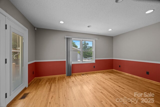 449 Concord Rd, Fletcher, NC 28732 - spare room with light wood finished floors, a textured ceiling, recessed lighting, and baseboards