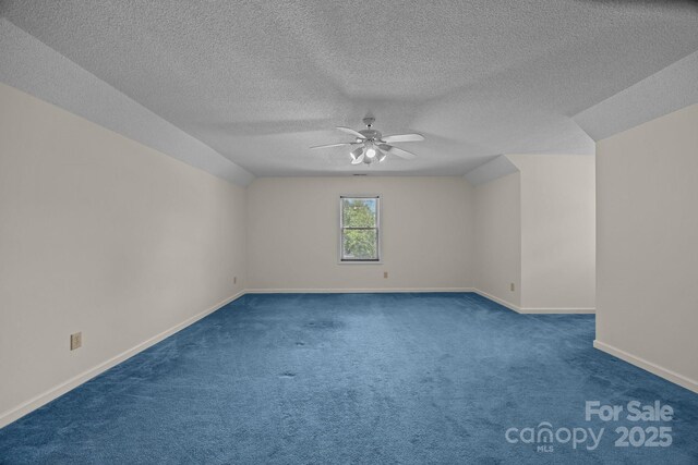 449 Concord Rd, Fletcher, NC 28732 - unfurnished room featuring a ceiling fan, baseboards, carpet flooring, a textured ceiling, and lofted ceiling