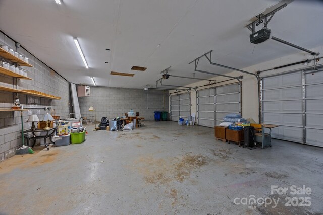 449 Concord Rd, Fletcher, NC 28732 - garage with a garage door opener and concrete block wall