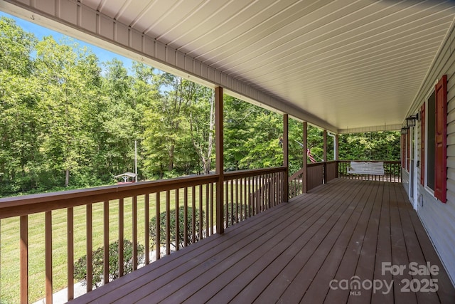 449 Concord Rd, Fletcher, NC 28732 - wooden deck with a lawn and a forest view