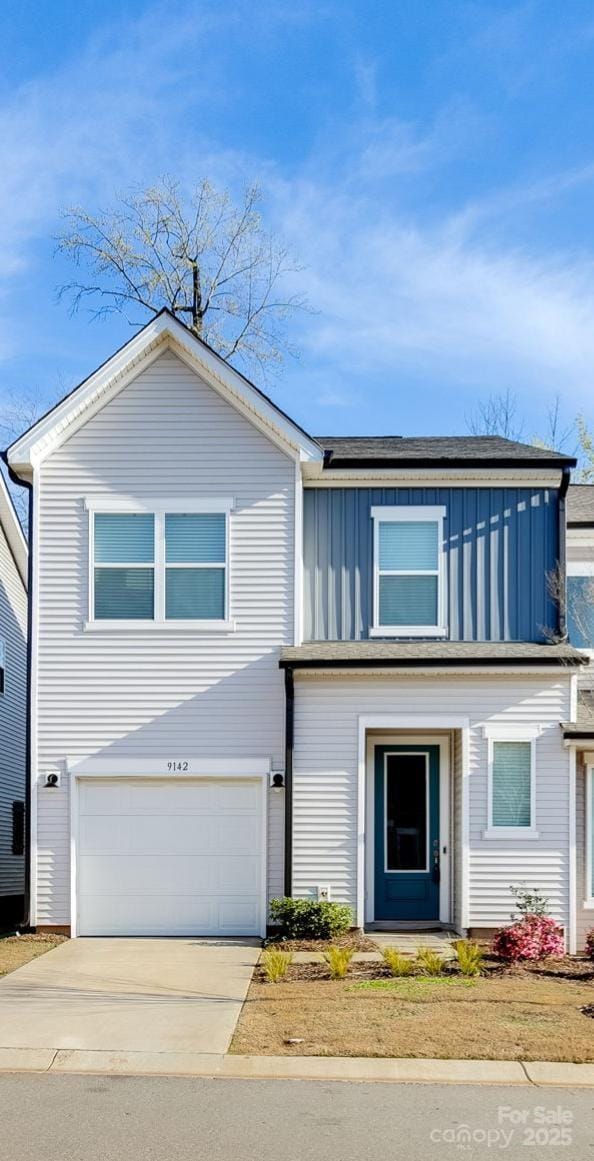 9142 Widden Way, Charlotte, NC 28269 - traditional-style house with board and batten siding, a garage, and driveway