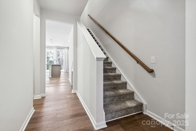 9142 Widden Way, Charlotte, NC 28269 - stairway with wood finished floors and baseboards