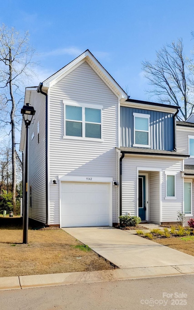 9142 Widden Way, Charlotte, NC 28269 - view of front of home featuring board and batten siding, a garage, and concrete driveway