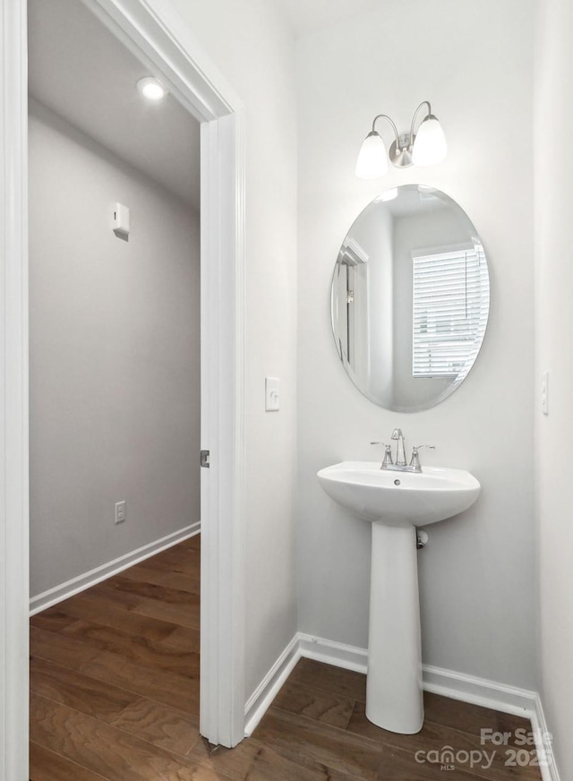 9142 Widden Way, Charlotte, NC 28269 - bathroom featuring baseboards and wood finished floors