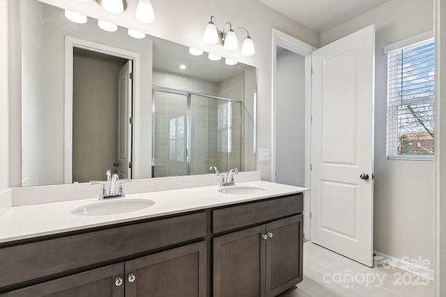 9142 Widden Way, Charlotte, NC 28269 - bathroom featuring double vanity, a shower stall, tile patterned flooring, and baseboards