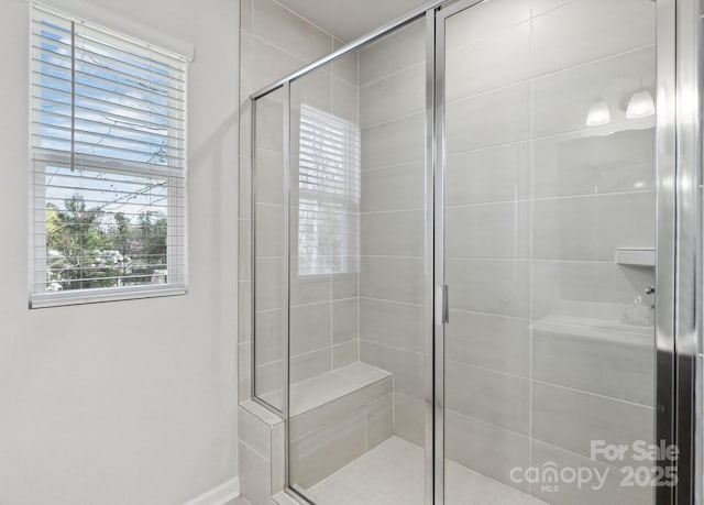 9142 Widden Way, Charlotte, NC 28269 - bathroom with a stall shower and baseboards