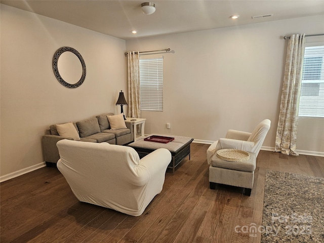 9142 Widden Way, Charlotte, NC 28269 - living room with dark wood-style flooring, baseboards, and recessed lighting