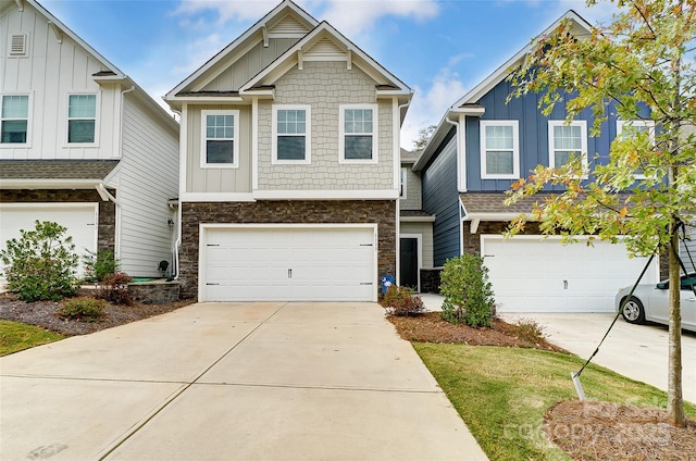 1133 Streamside Ln, York, SC 29745 - view of front of home with board and batten siding, stone siding, a garage, and concrete driveway