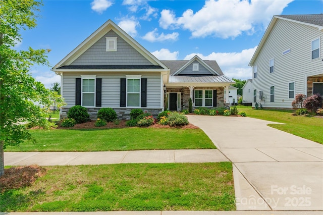 174 Pine Eagle Dr, Rock Hill, SC 29732 - craftsman-style house featuring stone siding, a front yard, and driveway