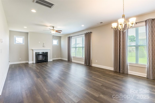174 Pine Eagle Dr, Rock Hill, SC 29732 - unfurnished living room featuring dark wood-type flooring, baseboards, a chandelier, a glass covered fireplace, and a ceiling fan