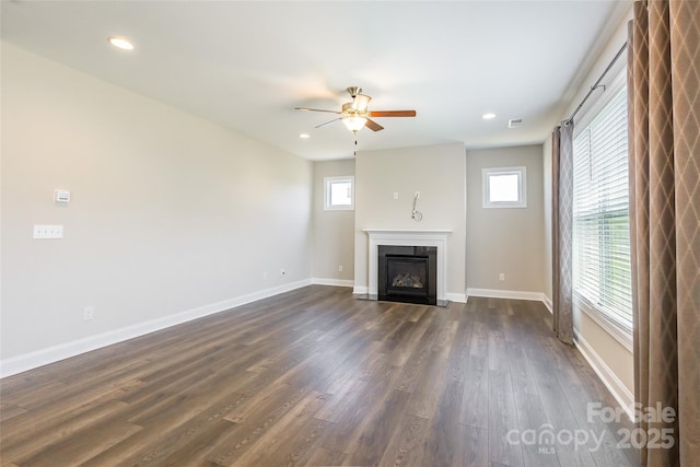 174 Pine Eagle Dr, Rock Hill, SC 29732 - unfurnished living room featuring a ceiling fan, dark wood-type flooring, a fireplace with flush hearth, baseboards, and recessed lighting