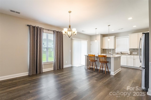 174 Pine Eagle Dr, Rock Hill, SC 29732 - kitchen with freestanding refrigerator, dark wood-type flooring, a kitchen island, recessed lighting, and white cabinetry