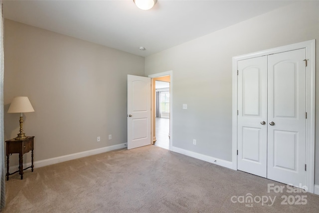 174 Pine Eagle Dr, Rock Hill, SC 29732 - unfurnished bedroom featuring carpet flooring, a closet, and baseboards