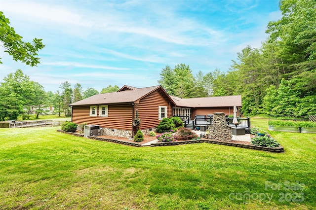 377 Birch Circle Dr, Hudson, NC 28638 - rear view of property with faux log siding, central AC unit, a deck, and a shingled roof