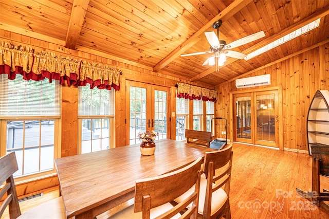 377 Birch Circle Dr, Hudson, NC 28638 - dining space with french doors, wooden ceiling, a wall mounted AC, wood walls, and light wood-style floors