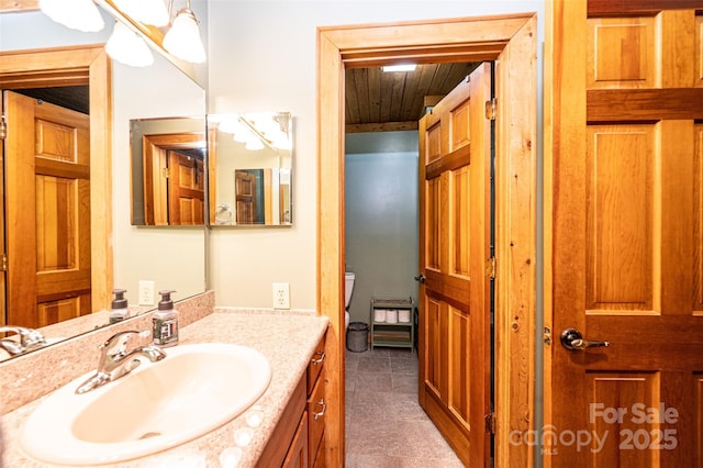 377 Birch Circle Dr, Hudson, NC 28638 - bathroom with vanity, wooden ceiling, tile patterned floors, and toilet