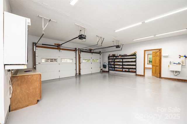 377 Birch Circle Dr, Hudson, NC 28638 - garage with a garage door opener and a sink