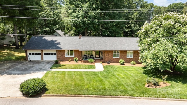 400 S Westover Dr, Monroe, NC 28112 - ranch-style house featuring concrete driveway, a garage, a front lawn, brick siding, and roof with shingles
