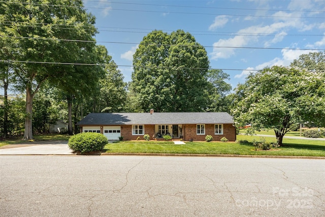400 S Westover Dr, Monroe, NC 28112 - single story home featuring driveway, an attached garage, a front lawn, and brick siding