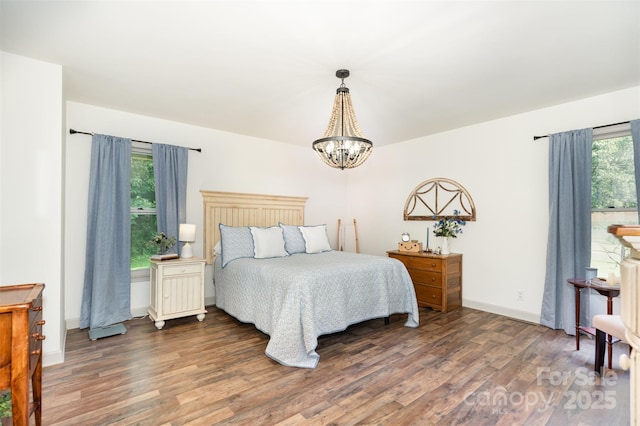 400 S Westover Dr, Monroe, NC 28112 - bedroom with wood finished floors, a chandelier, and baseboards