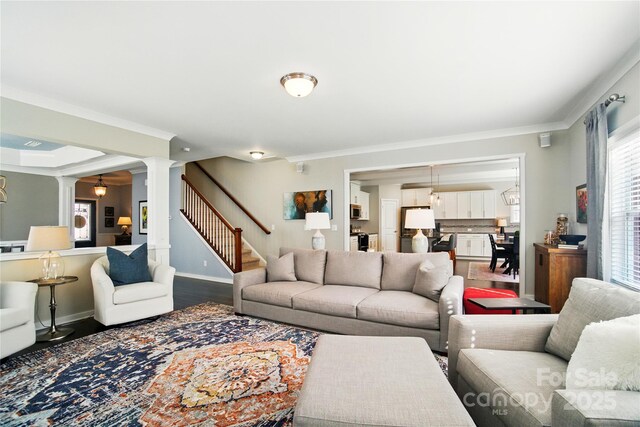2246 Bluebell Way, Tega Cay, SC 29708 - living room featuring ornate columns, ornamental molding, stairway, baseboards, and wood finished floors
