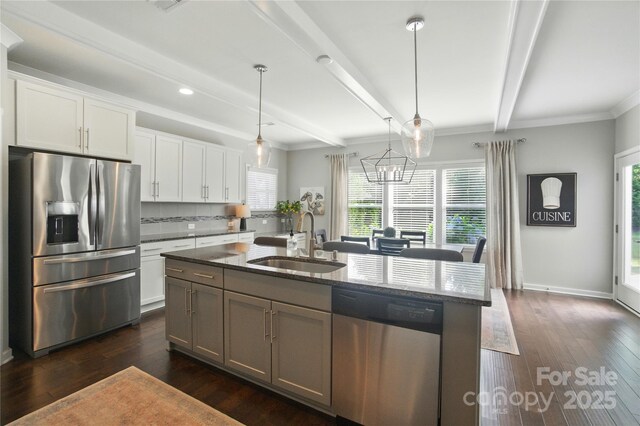 2246 Bluebell Way, Tega Cay, SC 29708 - kitchen featuring stainless steel appliances, a sink, dark stone countertops, beamed ceiling, and plenty of natural light