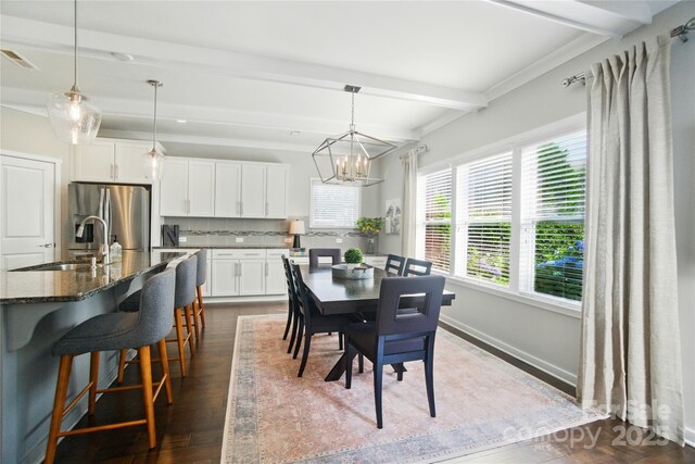 2246 Bluebell Way, Tega Cay, SC 29708 - dining space with beamed ceiling, dark wood-type flooring, a chandelier, and baseboards