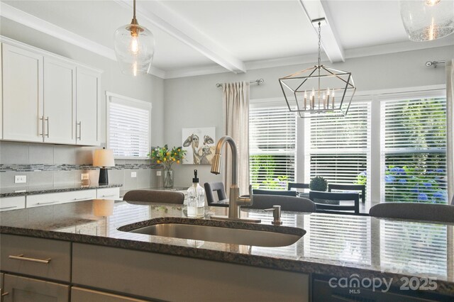 2246 Bluebell Way, Tega Cay, SC 29708 - kitchen featuring beamed ceiling, a sink, plenty of natural light, and tasteful backsplash