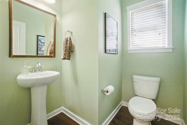 2246 Bluebell Way, Tega Cay, SC 29708 - bathroom featuring toilet, baseboards, and wood finished floors