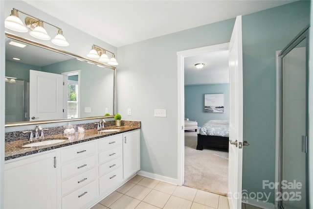 2246 Bluebell Way, Tega Cay, SC 29708 - ensuite bathroom with double vanity, tile patterned flooring, a stall shower, and baseboards