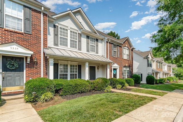 5322 Jocelyn Ln, Charlotte, NC 28269 - multi unit property with a standing seam roof, brick siding, a front lawn, and entry steps