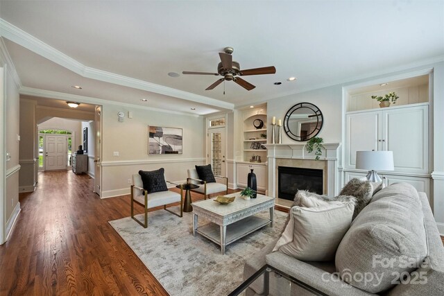 7319 Stonehaven Dr, Waxhaw, NC 28173 - living room featuring ceiling fan, dark wood-style flooring, recessed lighting, a glass covered fireplace, and crown molding