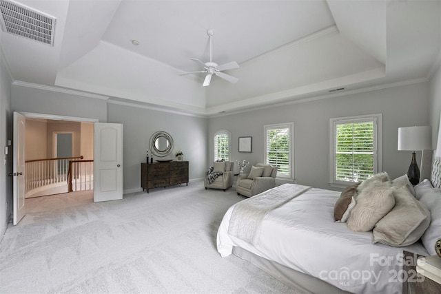 7319 Stonehaven Dr, Waxhaw, NC 28173 - bedroom featuring a tray ceiling, light carpet, ceiling fan, crown molding, and baseboards