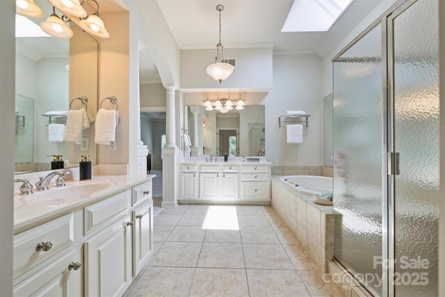 7319 Stonehaven Dr, Waxhaw, NC 28173 - bathroom with crown molding, two vanities, a garden tub, ornate columns, and a shower stall