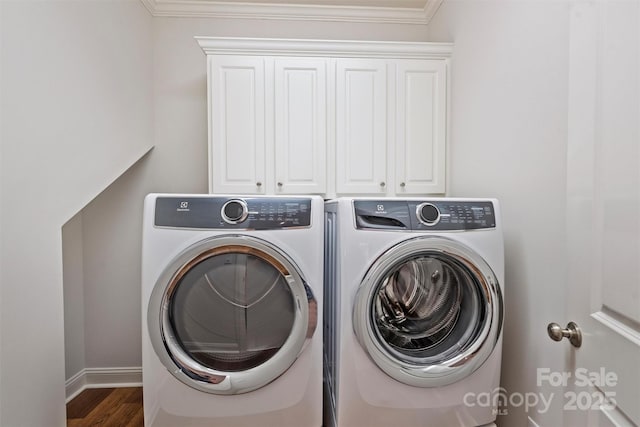 7319 Stonehaven Dr, Waxhaw, NC 28173 - laundry area with washer and clothes dryer, cabinet space, crown molding, wood finished floors, and baseboards