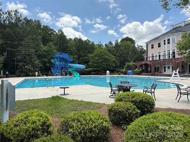7319 Stonehaven Dr, Waxhaw, NC 28173 - community pool featuring a water slide and a patio area