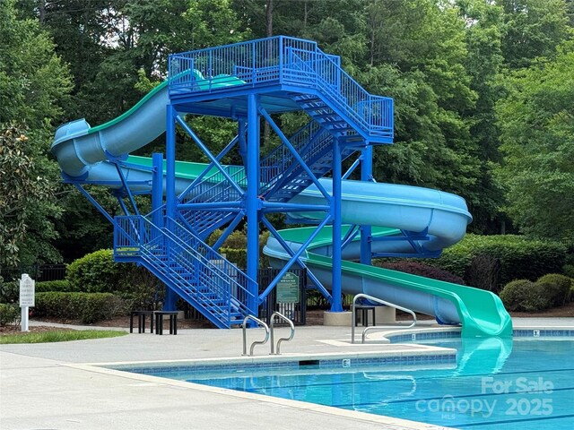 7319 Stonehaven Dr, Waxhaw, NC 28173 - community pool with a water slide and stairway