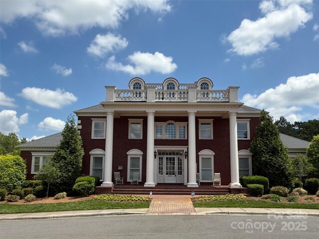 7319 Stonehaven Dr, Waxhaw, NC 28173 - neoclassical home with covered porch, a balcony, and french doors