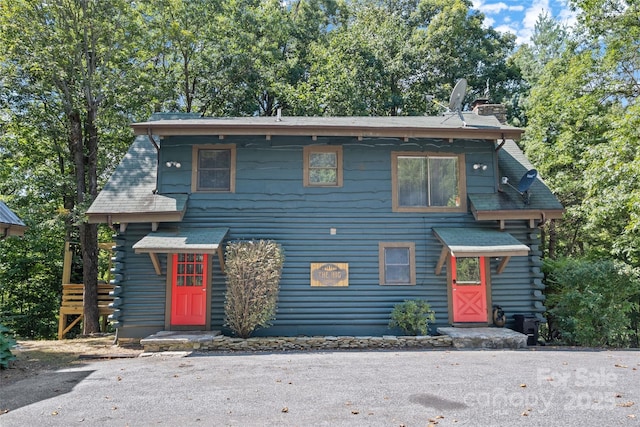214 Mckenzie Way, Old Fort, NC 28762 - view of front of home with a chimney, log siding, and stairs