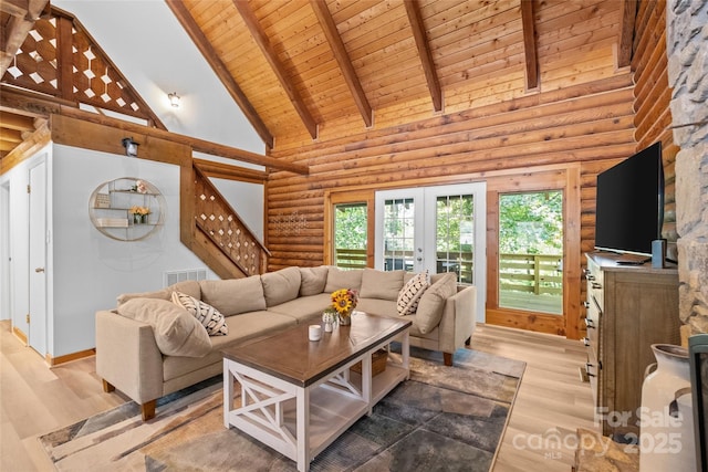 214 Mckenzie Way, Old Fort, NC 28762 - living room with wood ceiling with exposed beams, high vaulted ceiling, light wood finished floors, french doors, and log walls