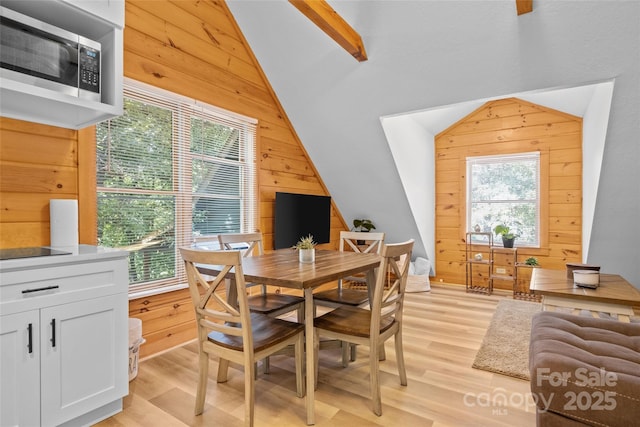 214 Mckenzie Way, Old Fort, NC 28762 - dining space with wood walls, light wood-style floors, and vaulted ceiling
