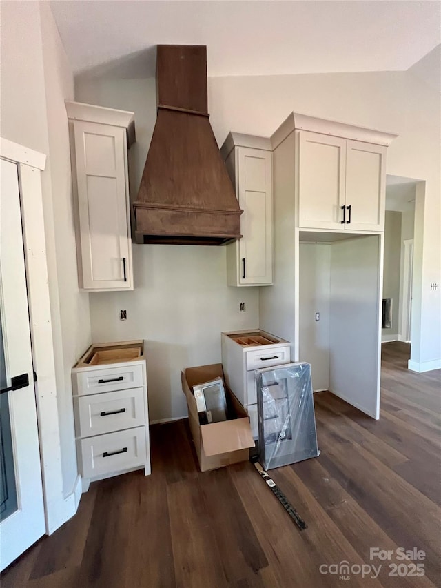 3000 Paul Payne Store Rd, Taylorsville, NC 28681 - kitchen with custom exhaust hood, vaulted ceiling, dark wood finished floors, and white cabinets