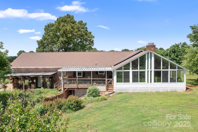 4026 Biggerstaff Rd, Maiden, NC 28650 - rear view of house with a chimney, a yard, and a sunroom