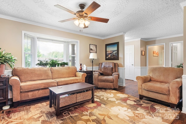 4026 Biggerstaff Rd, Maiden, NC 28650 - living room with a ceiling fan, wood finished floors, a wainscoted wall, a textured ceiling, and crown molding