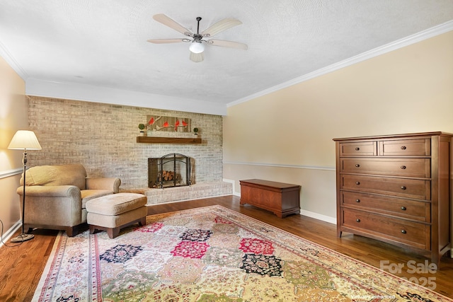 4026 Biggerstaff Rd, Maiden, NC 28650 - living room with ceiling fan, wood finished floors, ornamental molding, and a brick fireplace