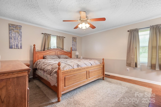 4026 Biggerstaff Rd, Maiden, NC 28650 - bedroom with light wood-style flooring, a textured ceiling, a ceiling fan, and crown molding