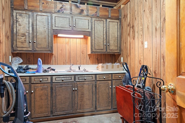 4026 Biggerstaff Rd, Maiden, NC 28650 - kitchen with light countertops, wooden walls, and concrete flooring