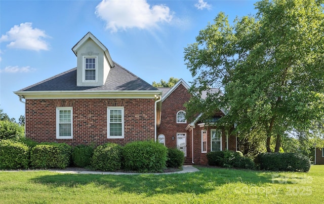 104 Fairwind Ct, Fort Mill, SC 29708 - view of front of property with brick siding, a front yard, and roof with shingles
